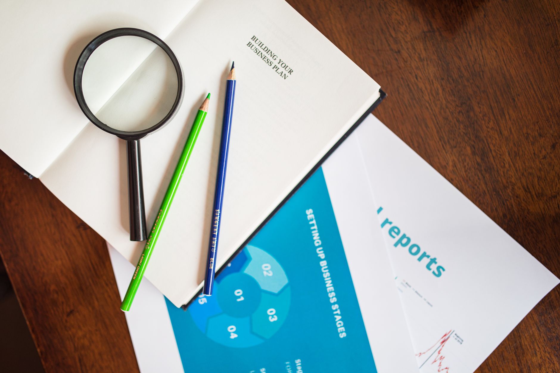 IT consultant reviewing a technology due diligence checklist with a business owner