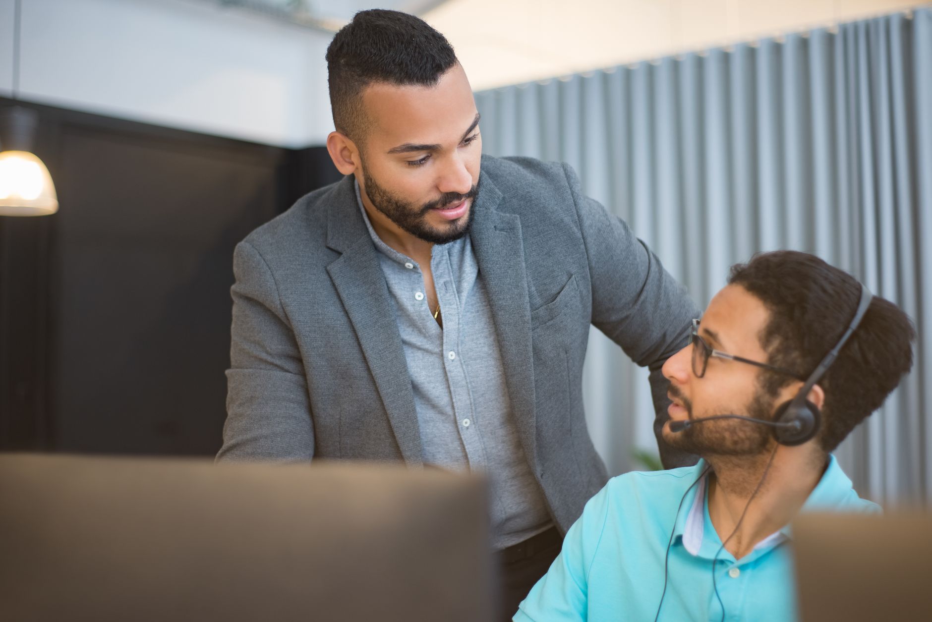 IT specialist advising a small business owner, illustrating managed IT vs break-fix decision